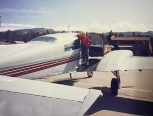 John on the wing of his dad's airplaine