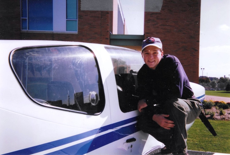 Young Spencer on the wing of an ariplane