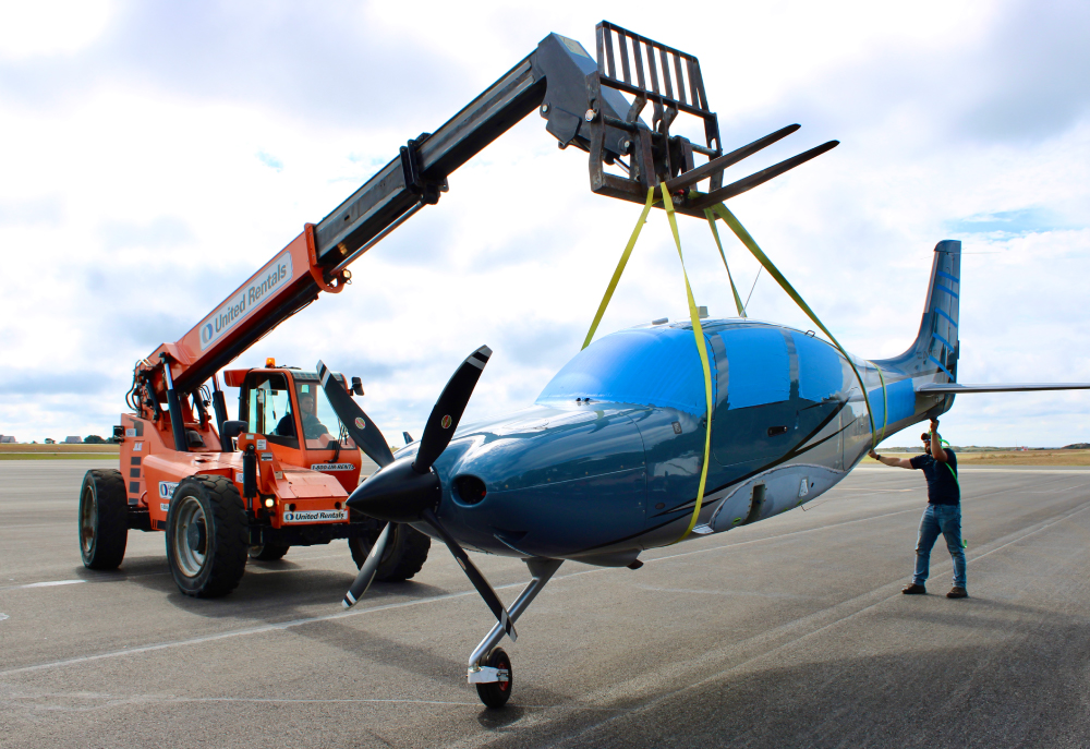 aircraft being lifted by crane