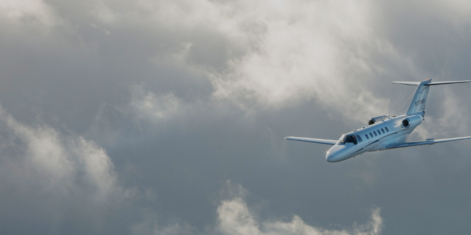 Plane in the cloudy sky