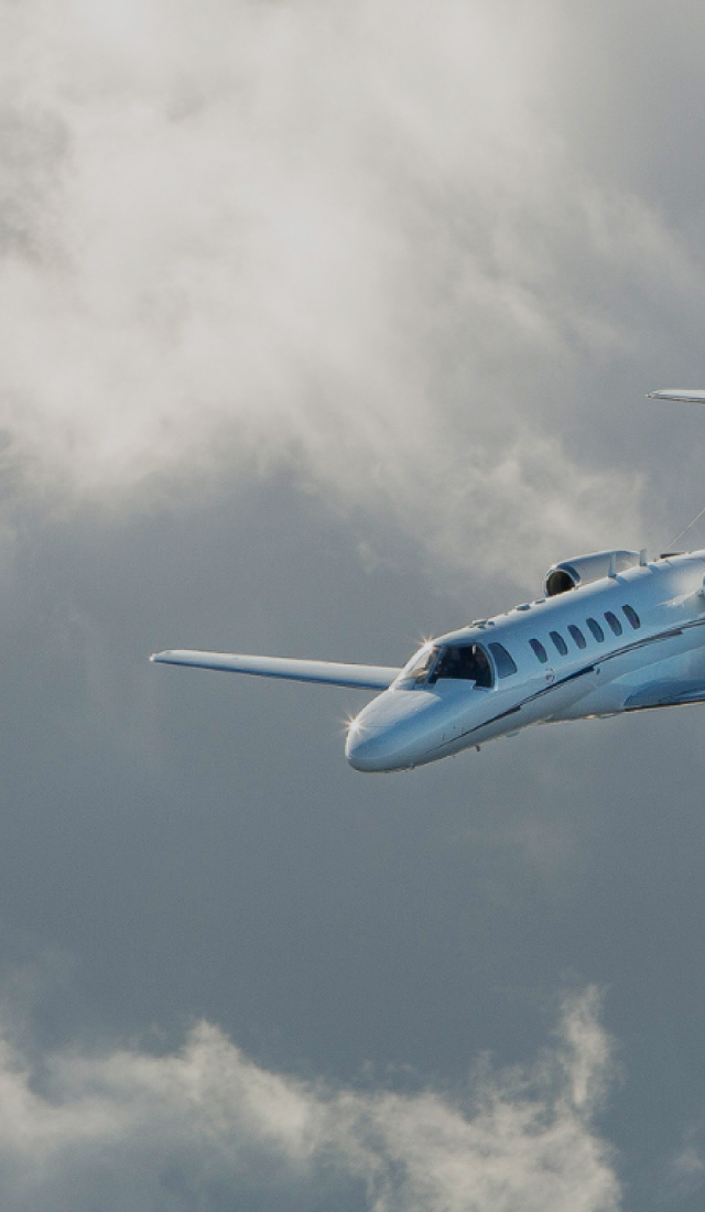 Plane in the cloudy sky