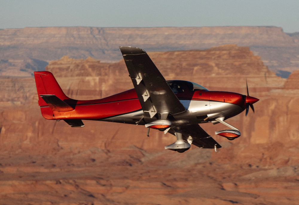 Red cirrus flying in front of desert landscape
