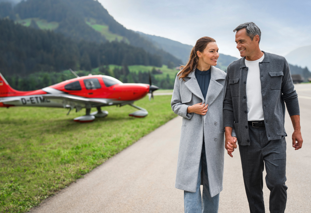 Couple walking away from plane in scenic location