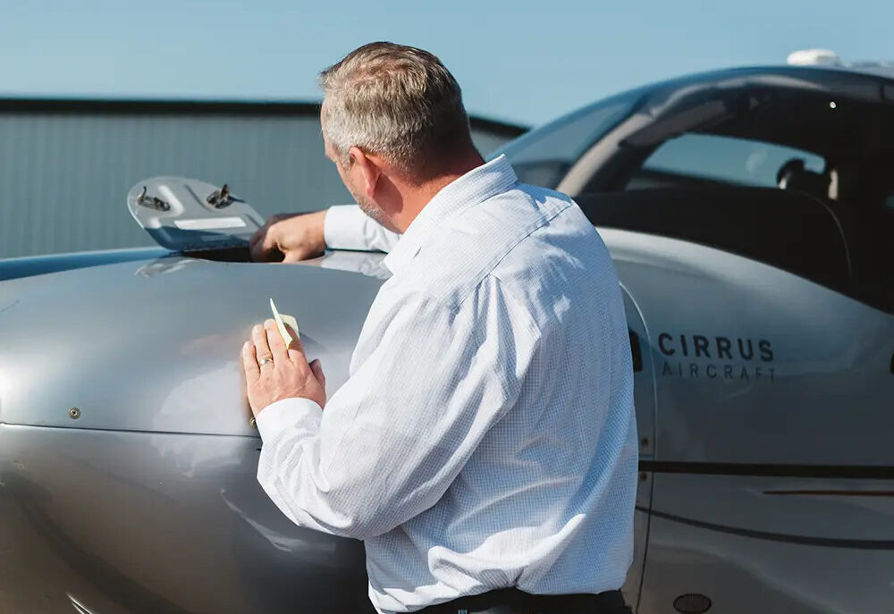 Lone Mountain employee performing aircraft inspections