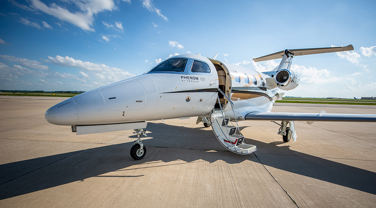 phenom 100 plane on runway