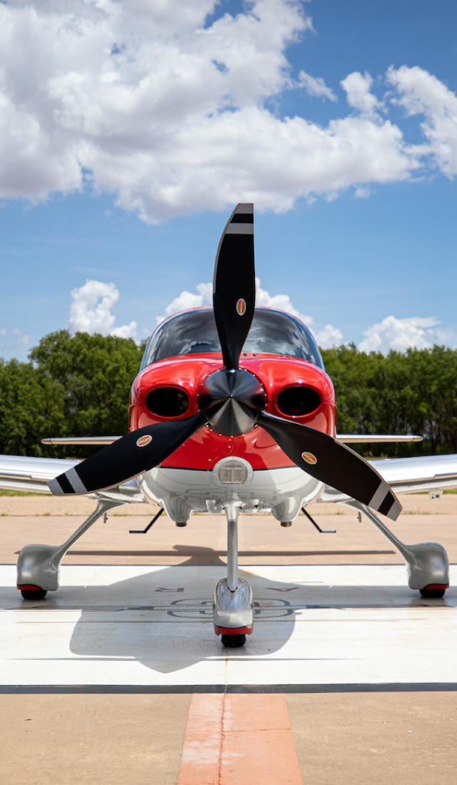 front of cirrus plane on tarmac
