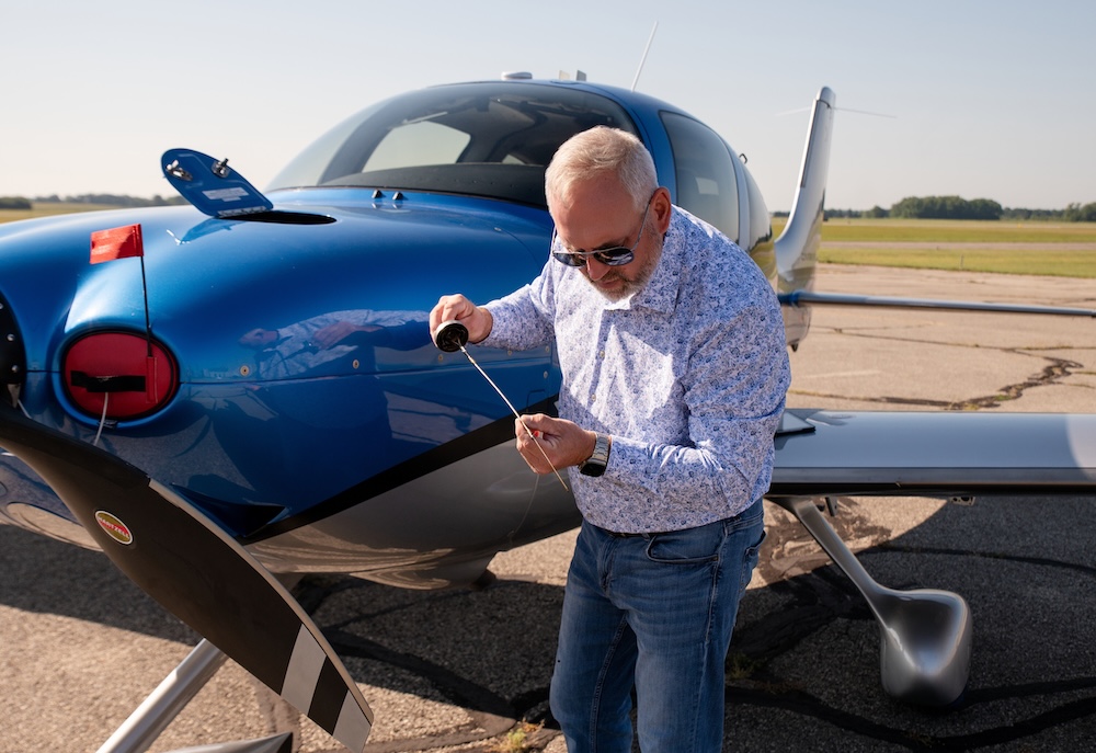 Lone Mountain employee performing aircraft inspections